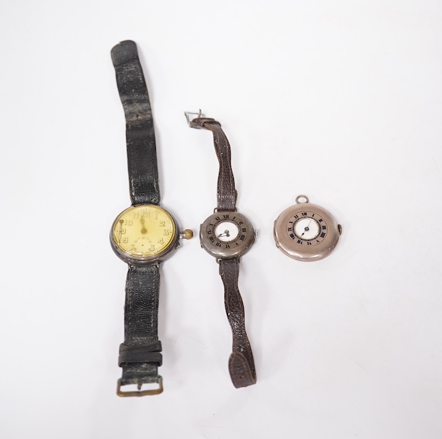 An early 20th century silver Borgel cased manual wind wrist watch(a.f.), one other similar silver half hunter manual wind wrist watch(no strap) and one other similar with a strap. Condition - poor